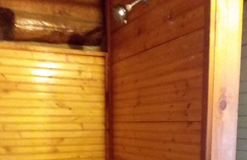 Eureka Springs Cabin | 100 year old log cabin. Spend your relaxing getaway with us