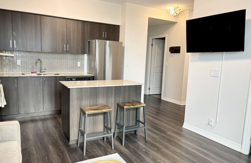 Rexdale Condo | 1BR+Den Near YYZ with Workspace