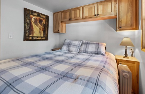 Historic Railroad District Cabin | 2 bedroom cabin, huge deck, lodge-style furnishings.