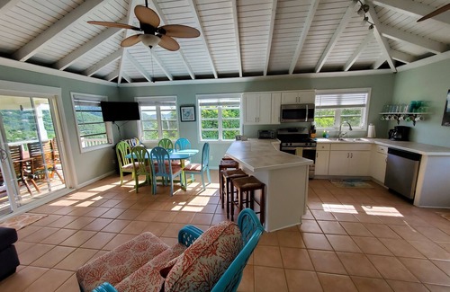 Lower Carolina Villa | 20% off! Charming cottage -water view, hot tub, outdoor shower, battery backup!