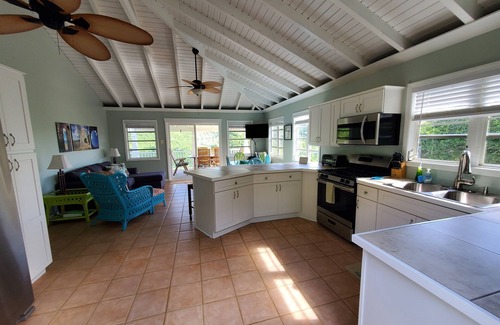 Lower Carolina Villa | 20% off! Charming cottage -water view, hot tub, outdoor shower, battery backup!