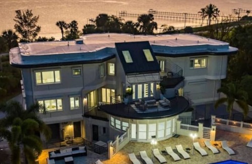 Fort Pierce Villa | 9K SF Waterfront Mansion, Pool, Boat Dock, Theater