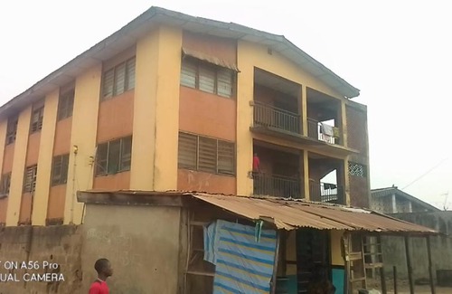 Ibadan Apartment | A 2-story building with 2 shops