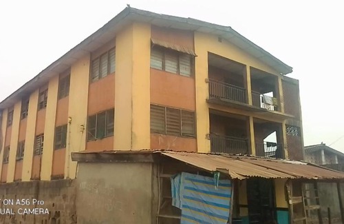 Ibadan Apartment | A 2-story building with 2 shops