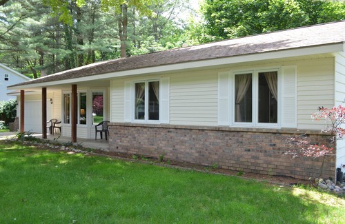 Holland House | A block from the beach! A beautiful wooded spot a 5 minute walk from Lake MI.