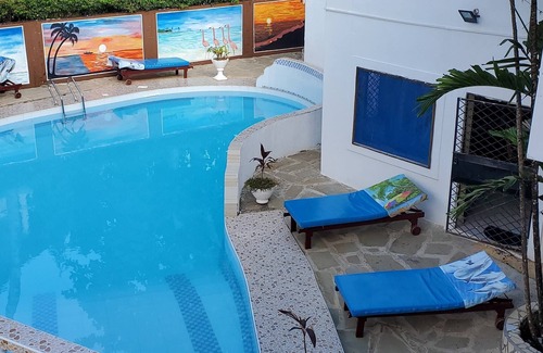 Galu Beach Hotel | A Sentimental Villa With a Swimmingpool Near Beach