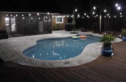 Crooked Creek House | Amazing home with heated pool, tiki bar and luscious outdoor close to beaches