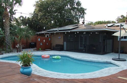 Crooked Creek House | Amazing home with heated pool, tiki bar and luscious outdoor close to beaches