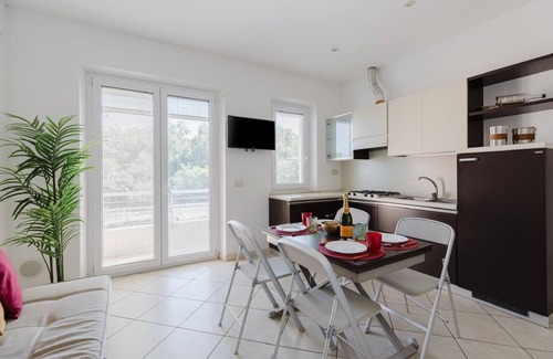 Torre Grande Apartment | Apartment 'La Baia Del Sole' with Shared Pool, Wi-Fi and Air Conditioning