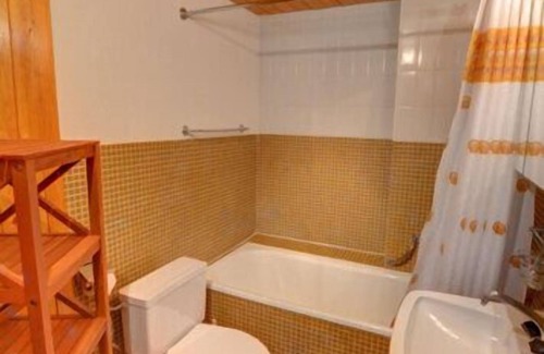 Anzere Apartment | Apartment with entrance corridor, bathroom/WC, bedroom with 2 single beds. Living room with chimney