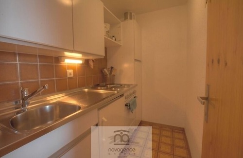 Anzere Apartment | Apartment with entrance corridor with 1 bunk beds, 1 bedroom with 2 single beds is separated from th
