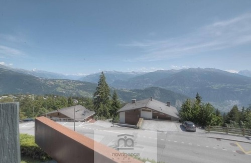 Anzere Apartment | Apartment with entrance corridor with 1 bunk beds, 1 bedroom with 2 single beds is separated from th