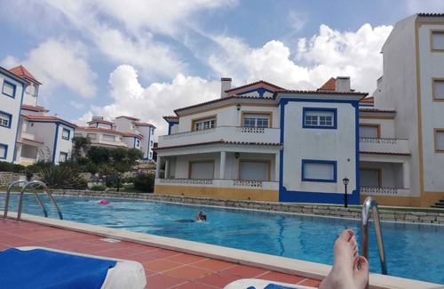 Praia del Rei Apartment | Apartment With Shared Pool, landscaped gardens, Wi-fi