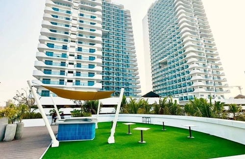 Bacolor Condo | Azure North Condo: Balcony & Scenic Views