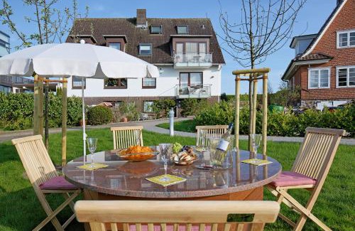 Strande Hotel | Büngers Apartment-Hotel mit Sommerstrandkorb & Gartensauna