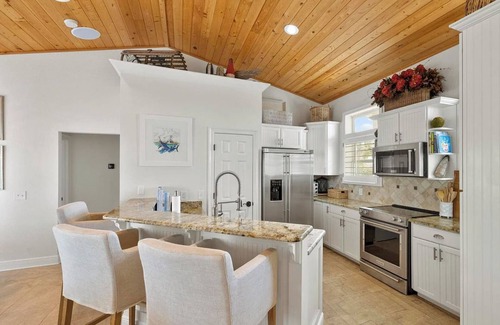 Villa Primera House | Beach Bungalow Steps from Pensacola Beach and Sound with Salt water heated pool