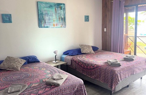 Esterillos Centro Hotel | Beachfront Escape in Esterillos Centro - Pool, A/C, WiFi & Private Rooms