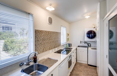 Bluff Hill House | Beachfront Pearl - Napier Holiday Home