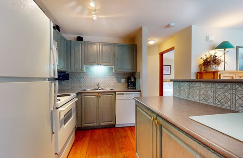 Village North Condo | Beautiful 1st-floor condo with fireplace & patio, short walk or shuttle to lifts