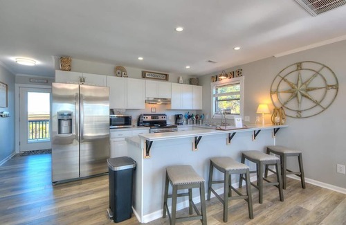 Caswell Beach House | Beautiful 3BR/2BA House, 2nd Row with ocean & icw views, Dog Friendly, Sleeps 10