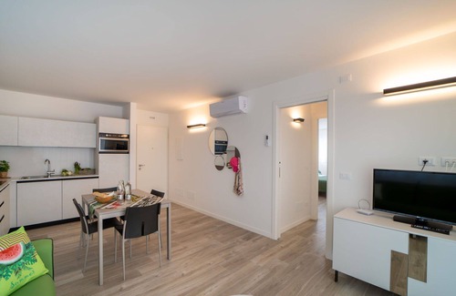 Lignano Sabbiadoro Apartment | Beautiful apartment for 4 people with A/C, WIFI, TV and balcony