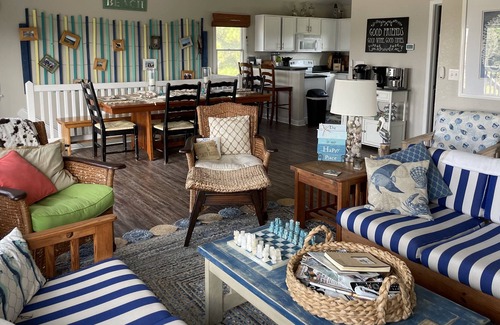 Carova Beach Cottage | Beautiful Canal front home in 4x4 area beach parking passes and linens included!
