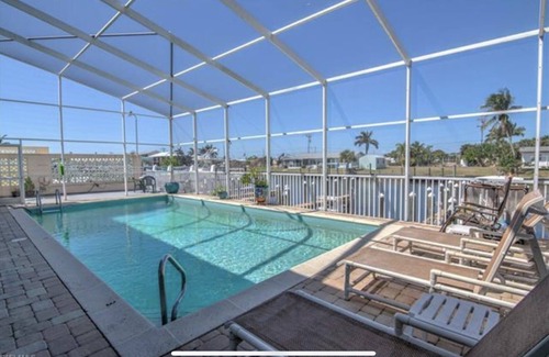Saint James City Condo | Beautiful SJC Island Condo w/heated pool on main canal, great fishing!