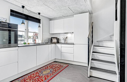 Øer Strand House | Beautiful terraced house on the water.
