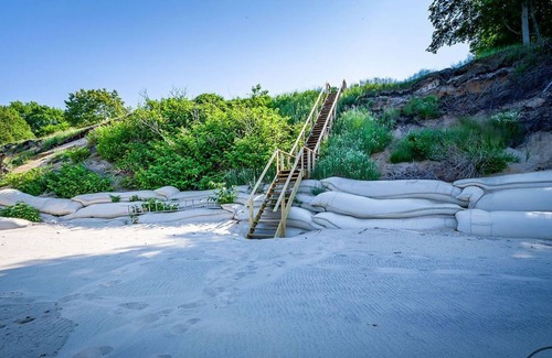 Muskegon House | Beautiful waterfront home with 190ft private sandy beach and stunning views