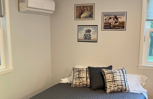 Ludington Apartment | Beautiful wooded area right outside your door and a 5 minute walk to Hamlin Lake