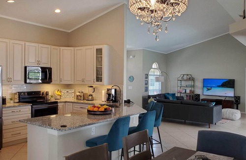 Central Naples House | Boutique Luxury Villa in Naples–Gated Cul-de-Sac Gem with Heated Saltwater Pool