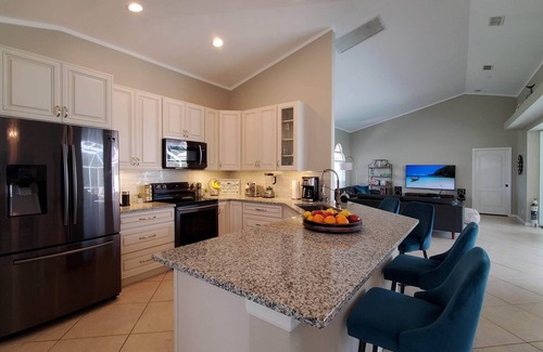 Central Naples House | Boutique Luxury Villa in Naples–Gated Cul-de-Sac Gem with Heated Saltwater Pool