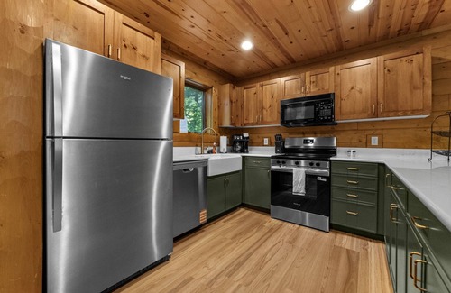 Boyne City Cottage | Boyne Mountain Cabin with Hot Tub Next to Skiing and Golf!