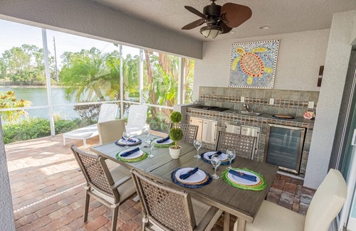 Central Naples House | Briarwood home w/heated pool/spa-outdoor kitchen-retractable awning-private lake view