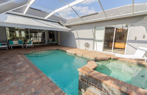 Central Naples House | Briarwood home w/heated pool/spa-outdoor kitchen-retractable awning-private lake view