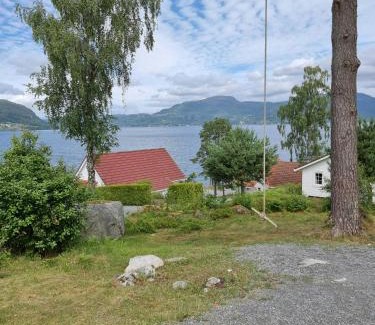 Hjelmeland House | Cabin By The Fjord With Rooftop Terrace On Randøy
