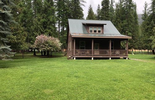 Libby House | Cabin by the river in the woods