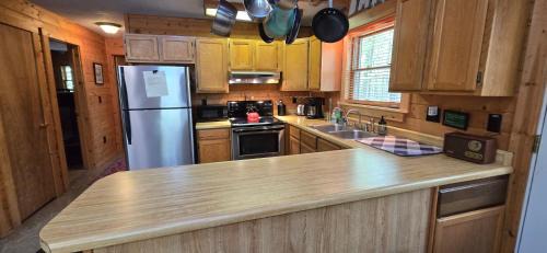Swanton House | Camp Valentine- charming 3 bedroom cabin with hot tub and fireplace in private setting