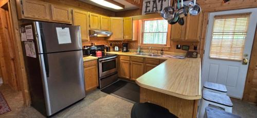 Swanton House | Camp Valentine- charming 3 bedroom cabin with hot tub and fireplace in private setting