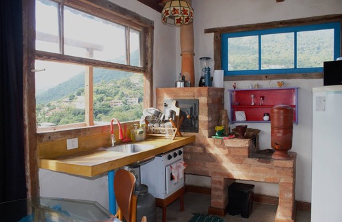 Ilhabela Historical Center Ski Chalet | CantaGalo Ilhabela rustic and cozy from where you can see the sea and the hills of the island.