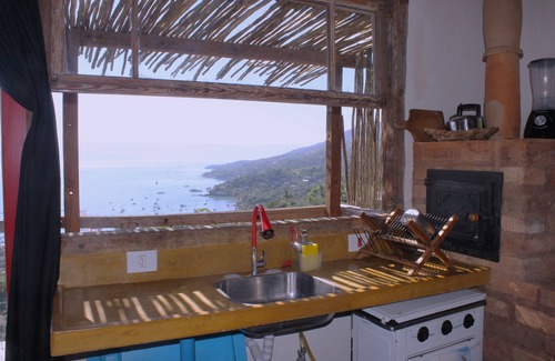 Ilhabela Historical Center Ski Chalet | CantaGalo Ilhabela rustic and cozy from where you can see the sea and the hills of the island.