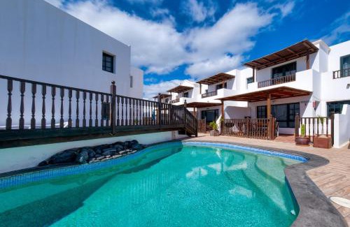 Punta Mujeres House | Casa Hibiscus - Shared Pool and BBQ - Close to Seafront Promenade By Lanzarote Vacation Homes