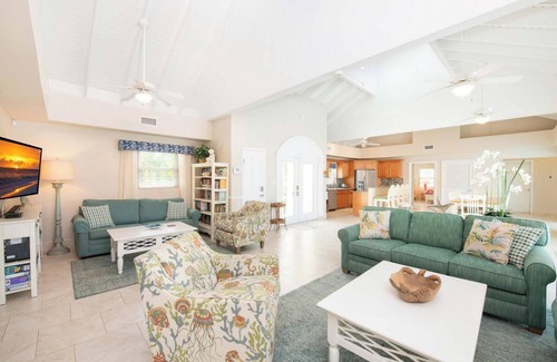 Old Man Bay House | Cayman Sands: Secluded Beach Villa with Pool Atrium & Guest Cottage