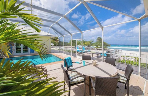 Old Man Bay House | Cayman Sands: Secluded Beach Villa with Pool Atrium & Guest Cottage