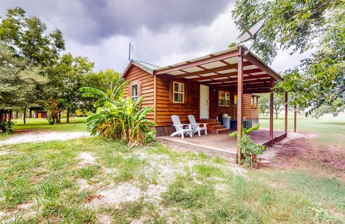 Waller Cabin | Cedar Cabin with Pretty Pond, Beach, Swimming Deck & Tropical Hut/Bar