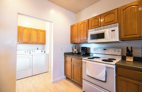 Evergreen House | Centrally-located two bedroom, two bathroom townhome with washer and dryer in a quiet neighborhood