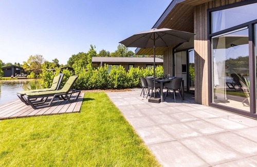 Municipality of Veldhoven Ski Chalet | Chalet by Pond in Holiday Park