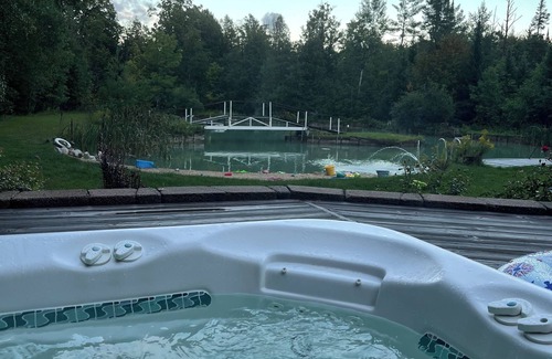 Fife Lake Ski Chalet | Chalet on Manistee River with amazing backyard pond. 5 minutes from Fife Lake.