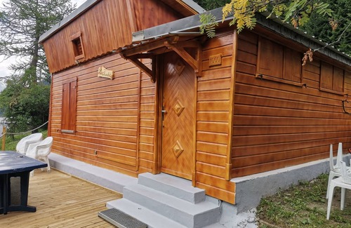 Valfrejus Ski Chalet | Chalet with terrace and breathtaking view. The grounds are adjacent to the chalet for BBQs etc.