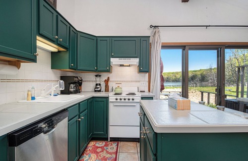 Gaylord House | Charming 3-bedroom Lakefront Home - Tons of Amenities like Firepits and WiFi